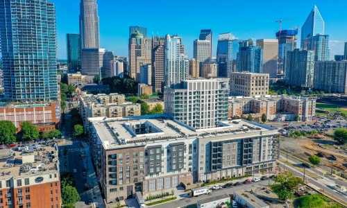 Aerial photo of 500 West Trade apartments overlooking uptown Charlotte and Fourth Ward