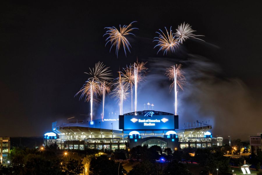 500 West Trade apartments in Charlotte, NC neighborhood The Bank of America Stadium with fireworks in the sky