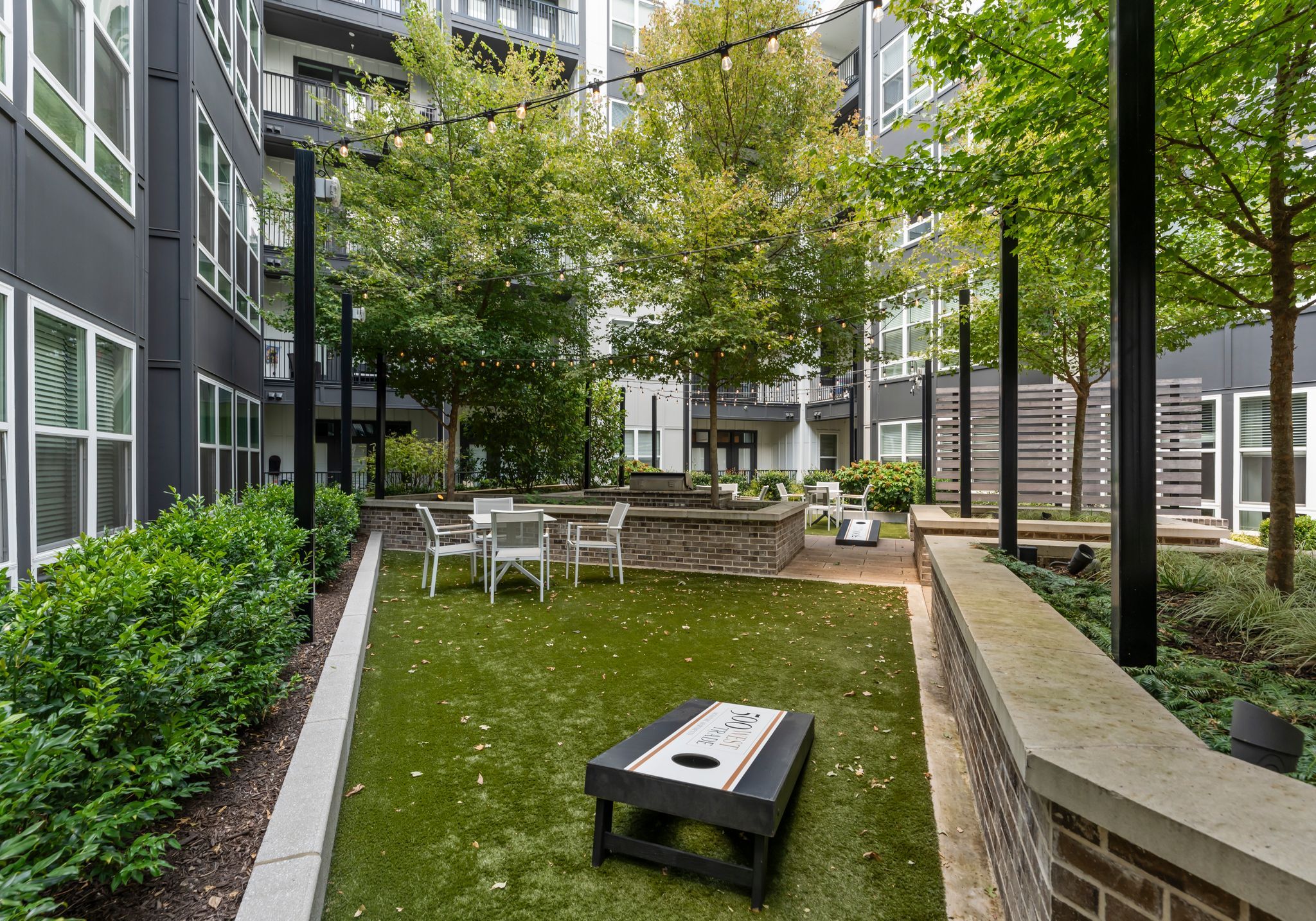 500 West Trade luxury apartments building exterior community amenities rooftop pool and hot tub with beautiful view of the city line and skyscrapers