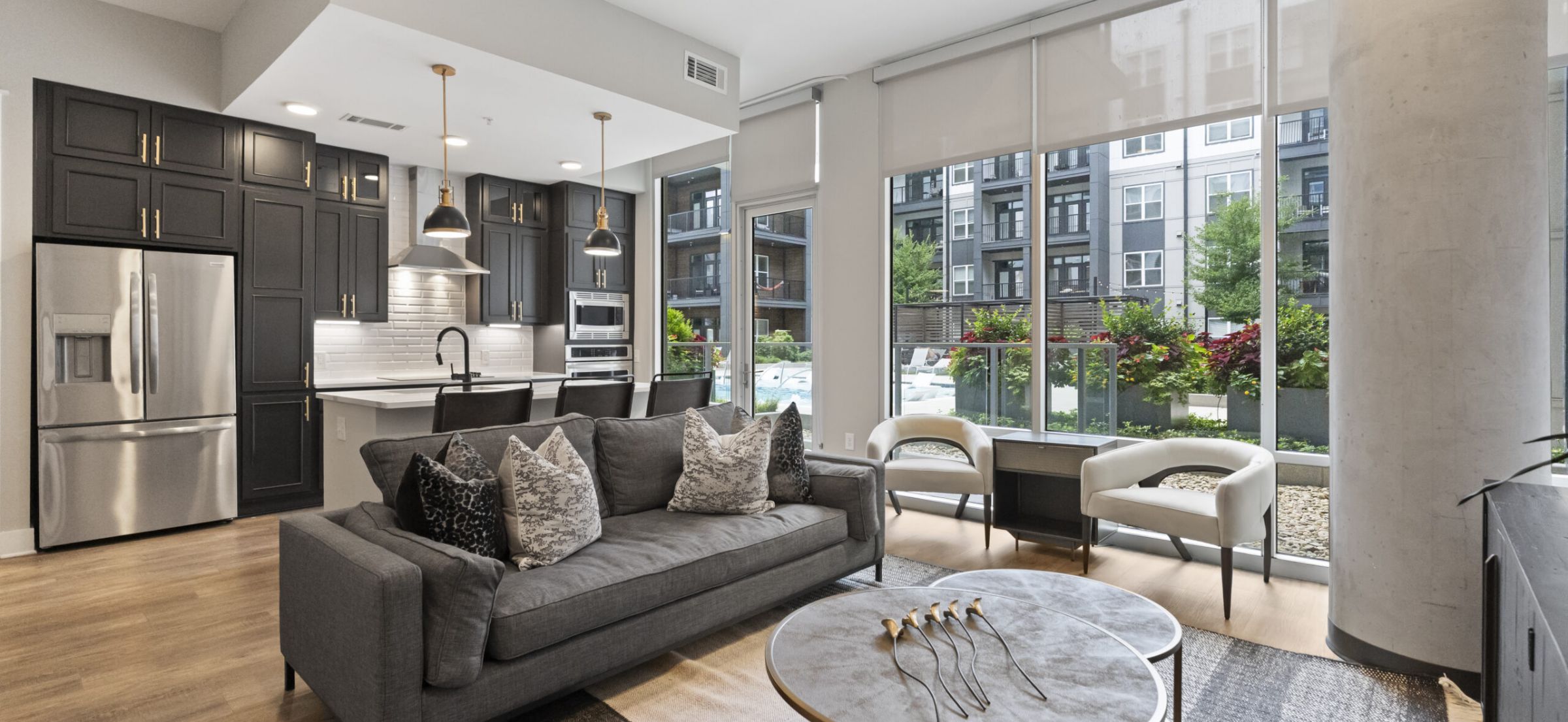 500 West Trade luxury apartments building building exterior community amenities rooftop pool with beautiful view of the city line and skyscrapers