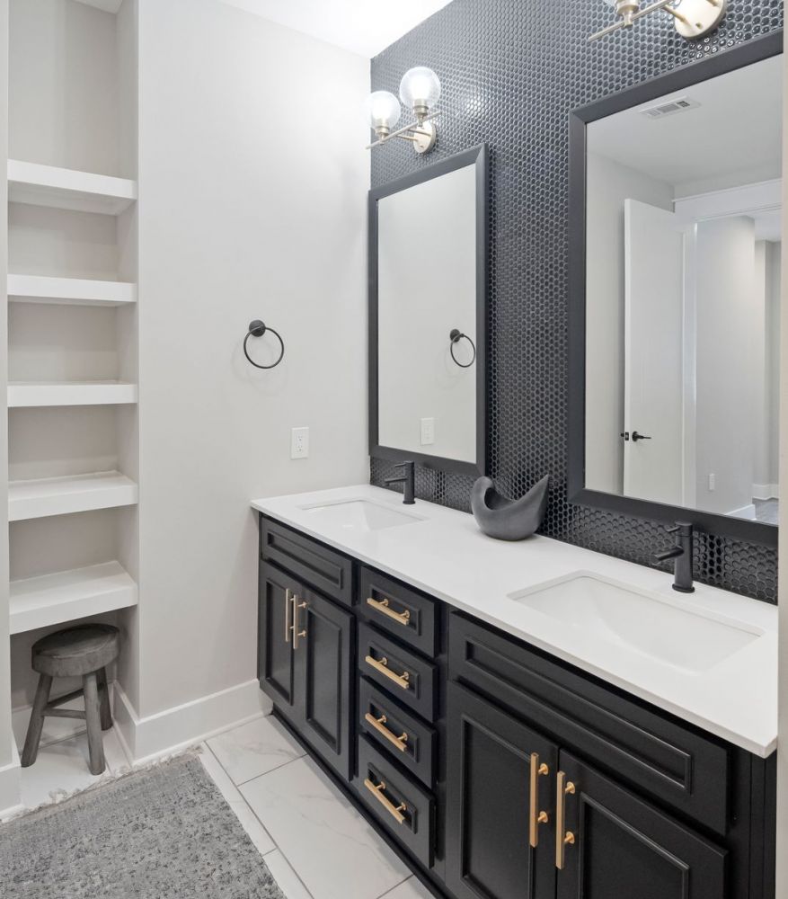 500 West Trade luxury apartment bedroom with bed, faux wood flooring, large closet, nice light, and wall art