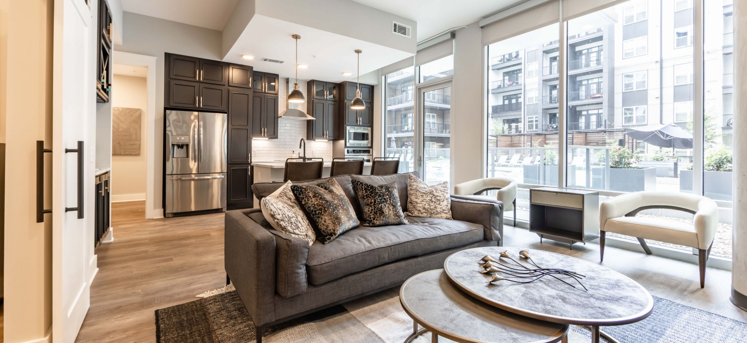 500 West Trade luxury apartments building building exterior community amenities rooftop pool with beautiful view of the city line and skyscrapers