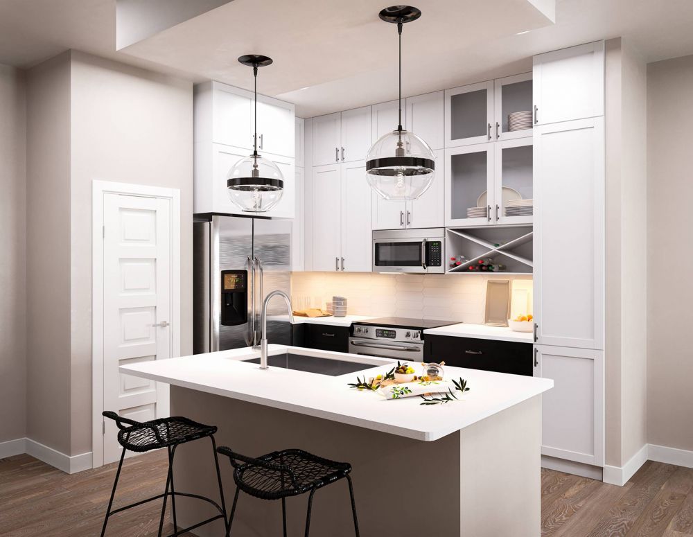 500 West Trade luxury apartment kitchen with island, bar stools, custom cabinets, and faux wood flooring