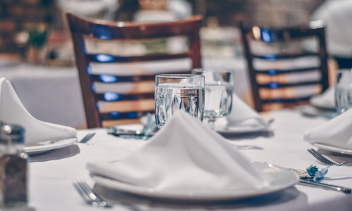 500 West Trade apartments neighborhood restaurant table setting
