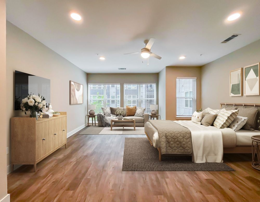 500 West Trade luxury apartment kitchen with island, bar stools, custom cabinets, and faux wood flooring