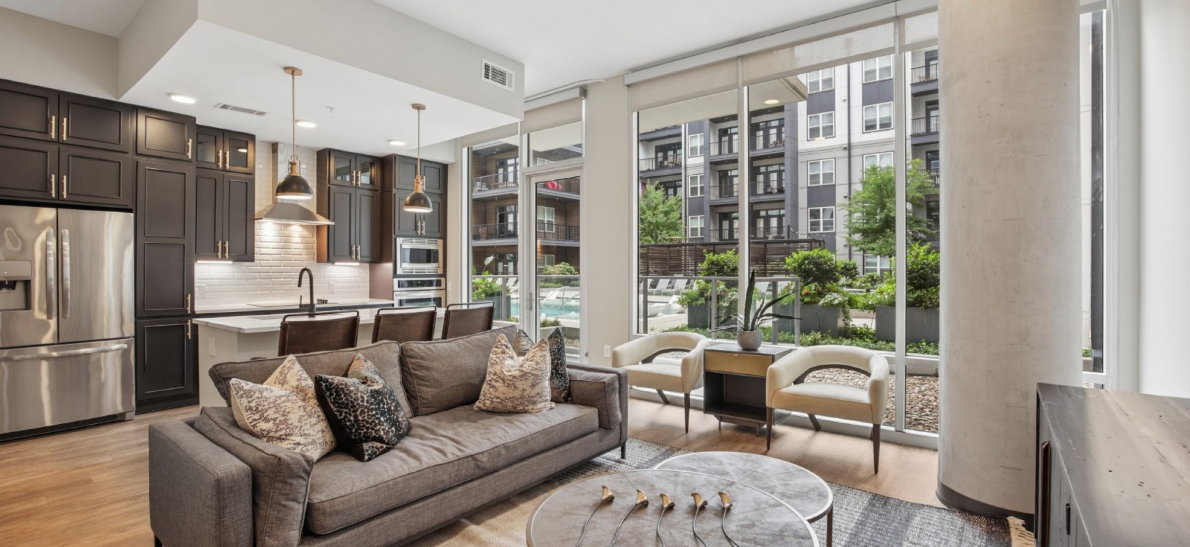 500 West Trade luxury apartments building building exterior community amenities rooftop pool with beautiful view of the city line and skyscrapers
