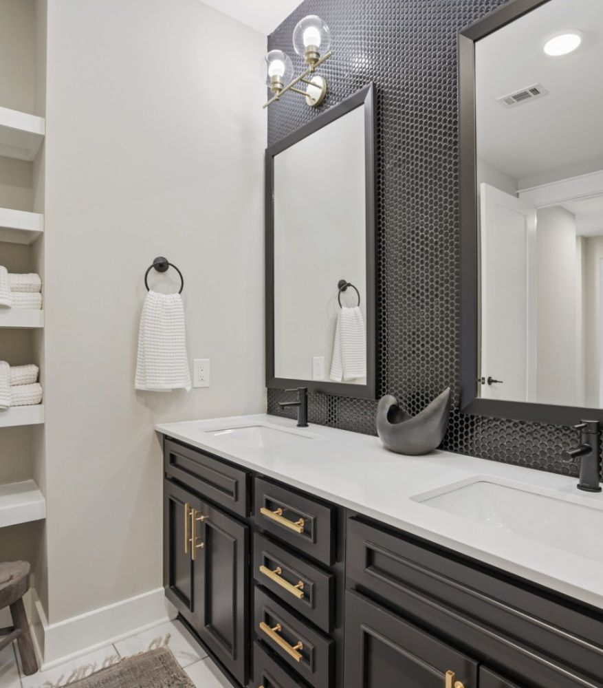 500 West Trade luxury apartment bedroom with bed, faux wood flooring, large closet, nice light, and wall art